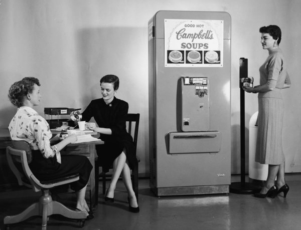 Women Use Soup Vending Machine At Work